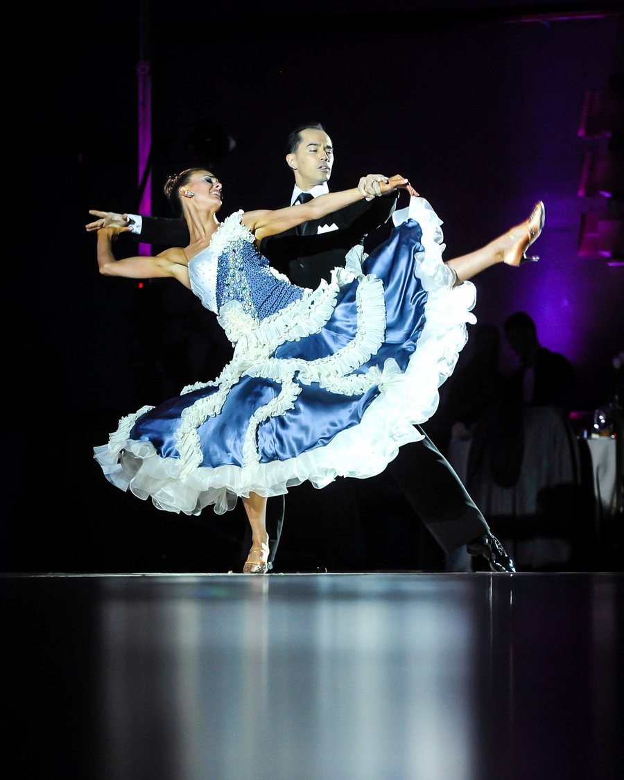 Michael Choi and Erin Marie in American Smooth under a spotlight